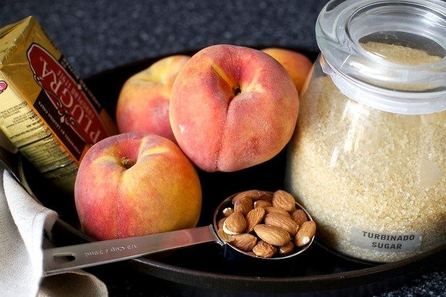 butter + peaches + almonds + sugar